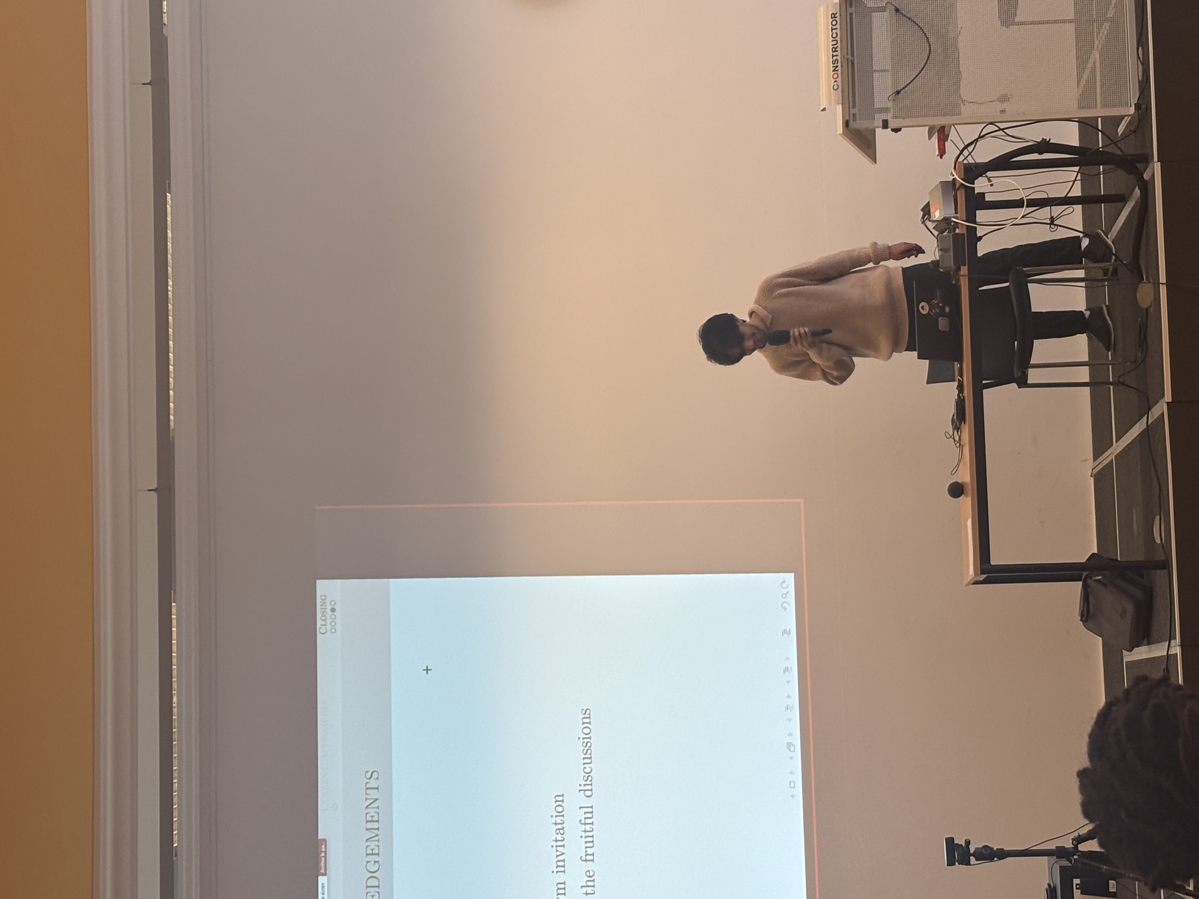 Omar Elshinawy delivering keynote — acknowledgements slide on screen