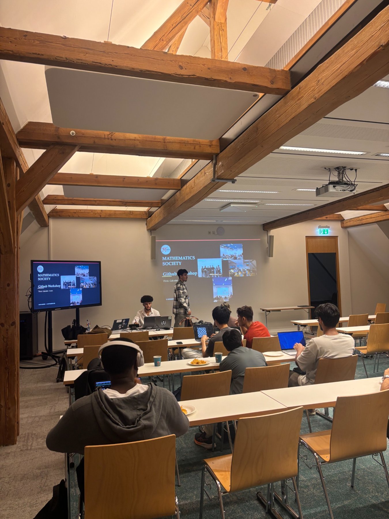 Attendees and demonstrations during the GitHub workshop