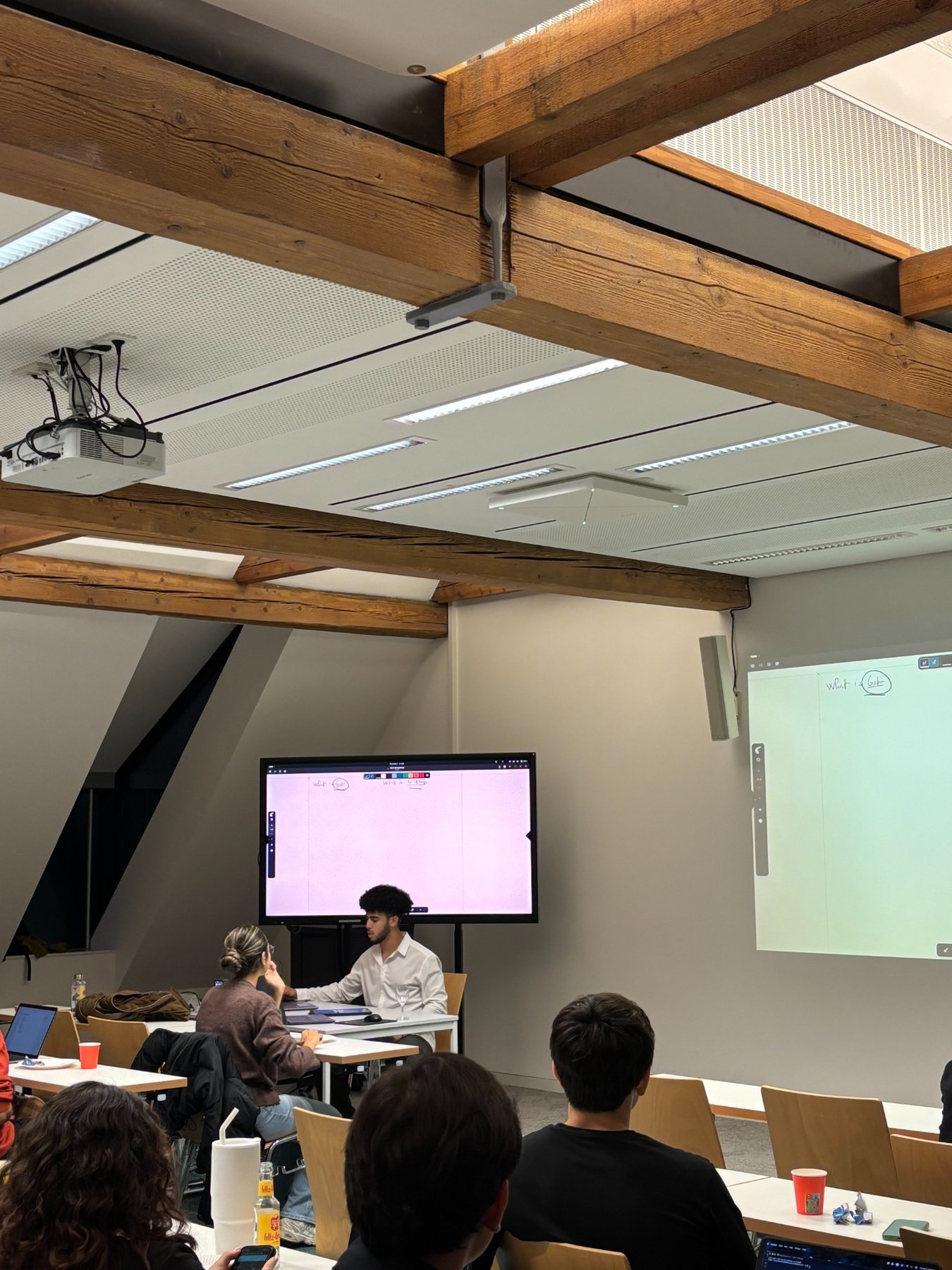 Attendees and demonstrations during the GitHub workshop