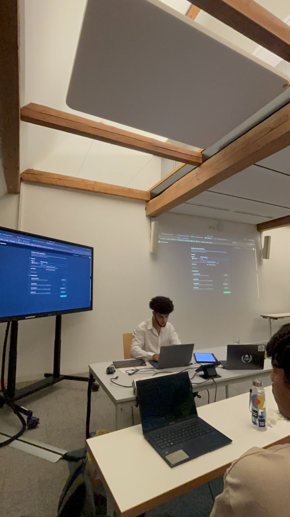 Attendees and demonstrations during the GitHub workshop
