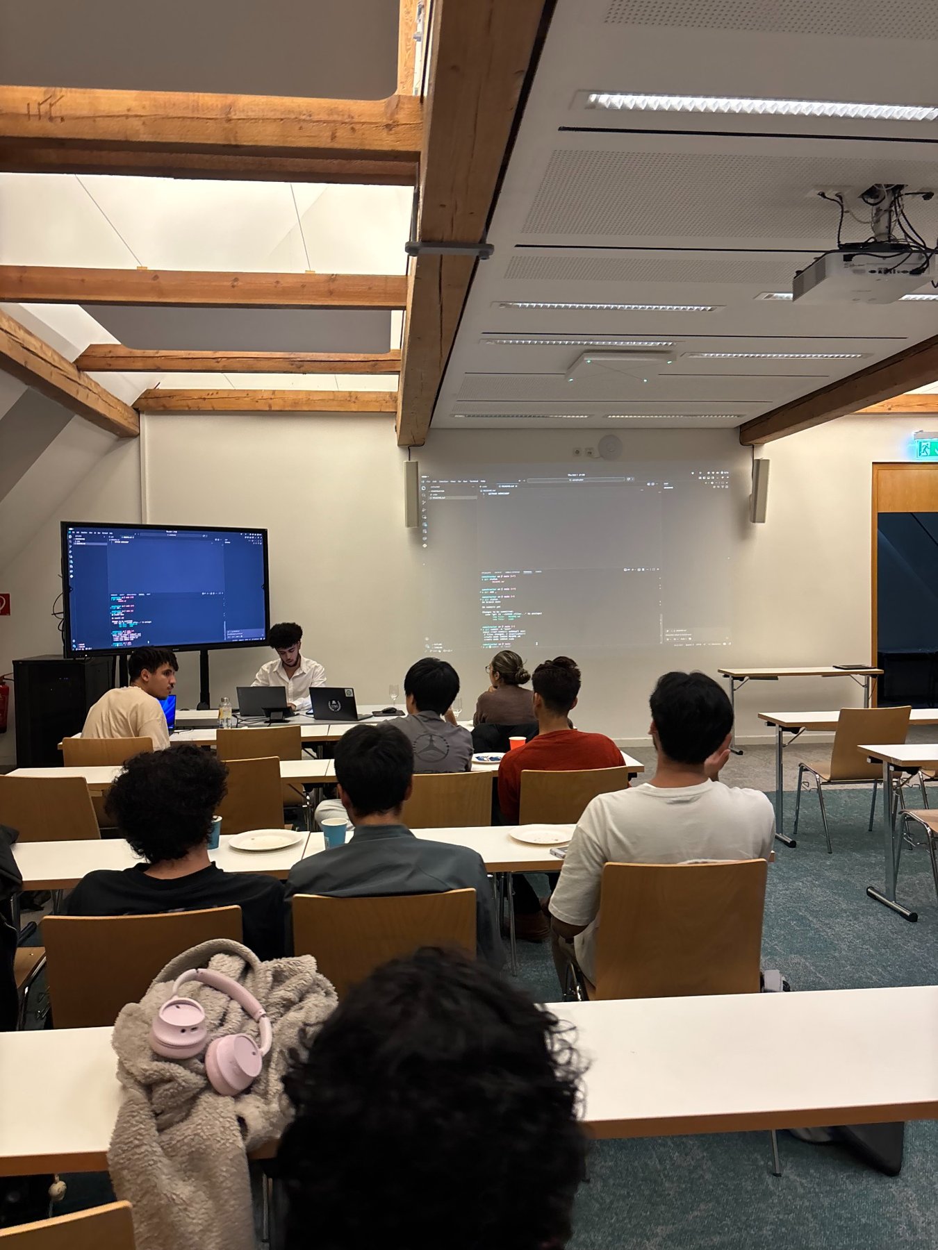 Attendees and demonstrations during the GitHub workshop