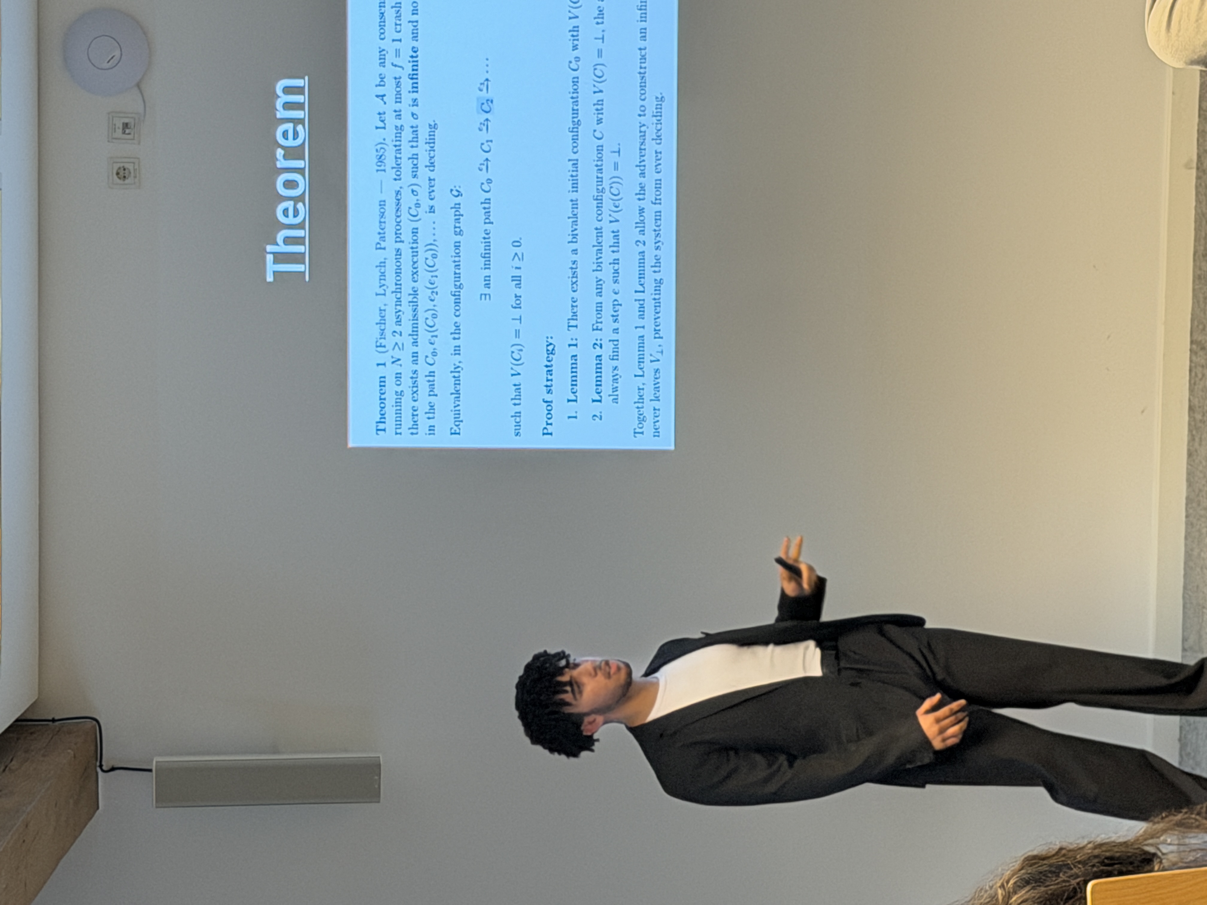 Taha Hbirri presenting the FLP theorem